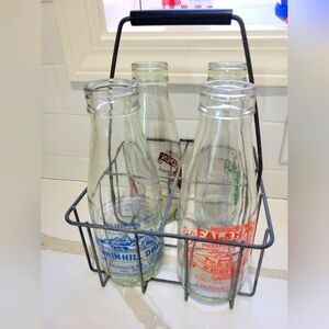 4 English Milk bottles with wire carrier